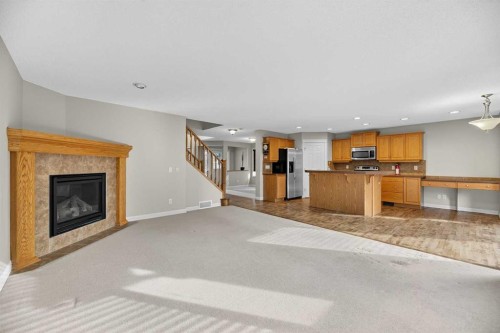 332 Sagewood Landing Sw, Airdrie, AB - Indoor Photo Showing Living Room With Fireplace