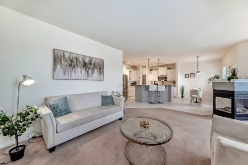 82 Mt Gibraltar Heights Se, Calgary, AB - Indoor Photo Showing Living Room With Fireplace