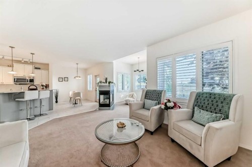 82 Mt Gibraltar Heights Se, Calgary, AB - Indoor Photo Showing Living Room With Fireplace