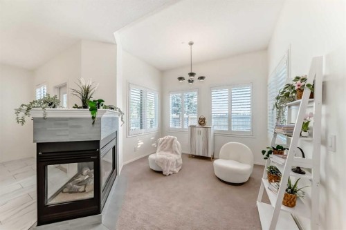 82 Mt Gibraltar Heights Se, Calgary, AB - Indoor With Fireplace