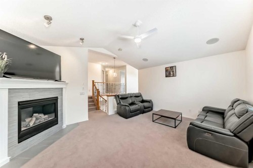 82 Mt Gibraltar Heights Se, Calgary, AB - Indoor Photo Showing Living Room With Fireplace