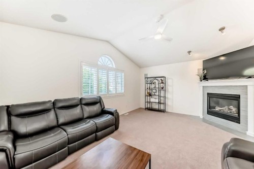 82 Mt Gibraltar Heights Se, Calgary, AB - Indoor Photo Showing Living Room With Fireplace