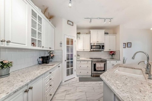 82 Mt Gibraltar Heights Se, Calgary, AB - Indoor Photo Showing Kitchen