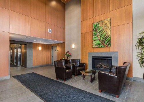 1801-77 Spruce Place Sw, Calgary, AB - Indoor With Fireplace