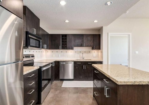 1801-77 Spruce Place Sw, Calgary, AB - Indoor Photo Showing Kitchen With Upgraded Kitchen