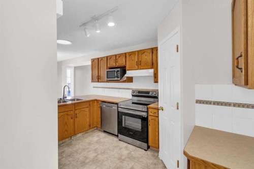 110 West Creek Bay, Chestermere, AB - Indoor Photo Showing Kitchen With Double Sink
