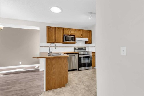 110 West Creek Bay, Chestermere, AB - Indoor Photo Showing Kitchen With Double Sink