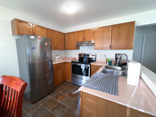 3 Alberta Avenue, Okotoks, AB - Indoor Photo Showing Kitchen With Double Sink