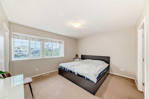 402-2066 Luxstone Boulevard Sw, Airdrie, AB - Indoor Photo Showing Bedroom