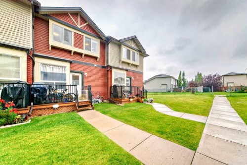 402-2066 Luxstone Boulevard Sw, Airdrie, AB - Outdoor With Deck Patio Veranda