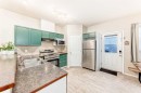 402-2066 Luxstone Boulevard Sw, Airdrie, AB  - Indoor Photo Showing Kitchen With Double Sink 