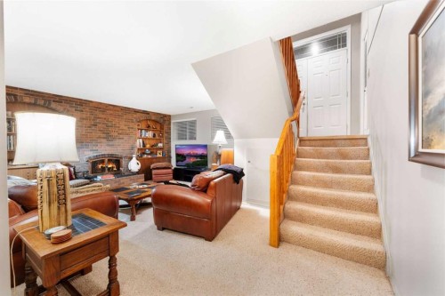 48 Thornwood Close Nw, Calgary, AB - Indoor With Fireplace