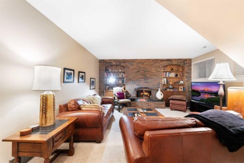48 Thornwood Close Nw, Calgary, AB - Indoor With Fireplace