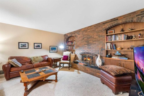 48 Thornwood Close Nw, Calgary, AB - Indoor Photo Showing Living Room With Fireplace