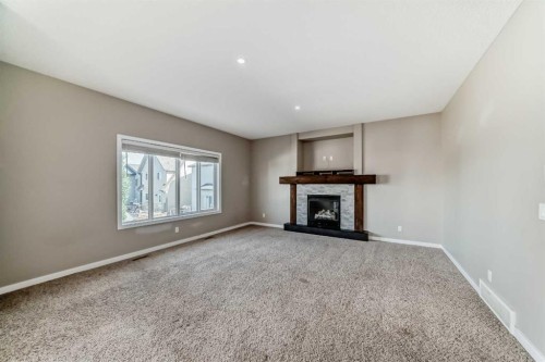 144 Reunion Grove Nw, Airdrie, AB - Indoor With Fireplace