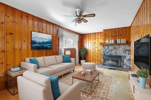 3224 Carol Drive Nw, Calgary, AB - Indoor Photo Showing Living Room With Fireplace