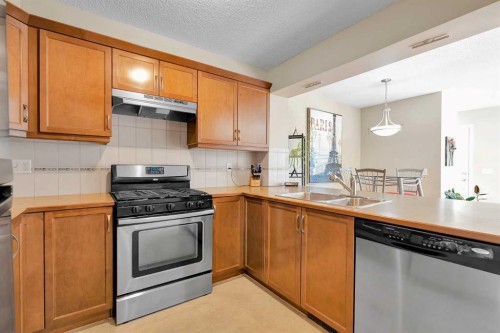 14 Windstone Lane Sw, Airdrie, AB - Indoor Photo Showing Kitchen With Double Sink