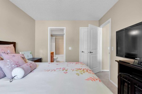 14 Windstone Lane Sw, Airdrie, AB - Indoor Photo Showing Bedroom