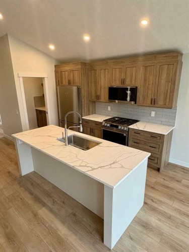 679 Anderson Close Nw, Diamond Valley, AB - Indoor Photo Showing Kitchen