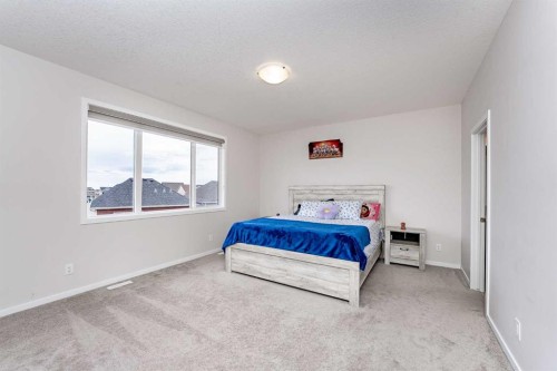 717 Windrow Manor Sw, Airdrie, AB - Indoor Photo Showing Bedroom