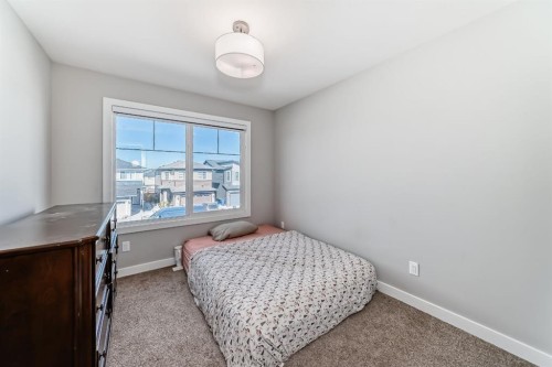 321 Carringvue Place Nw, Calgary, AB - Indoor Photo Showing Bedroom