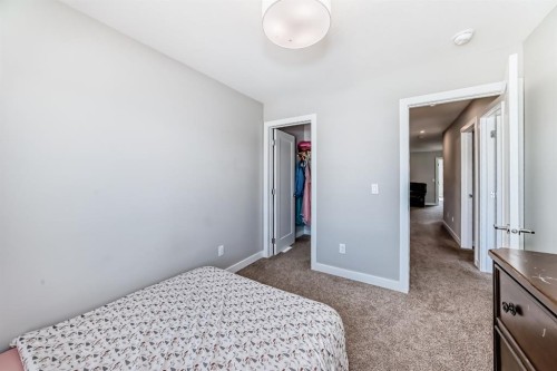 321 Carringvue Place Nw, Calgary, AB - Indoor Photo Showing Bedroom