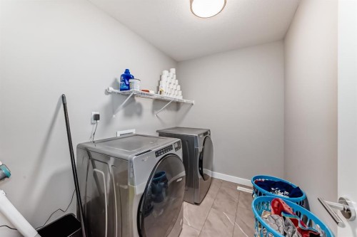 321 Carringvue Place Nw, Calgary, AB - Indoor Photo Showing Laundry Room