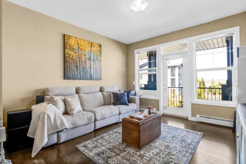 306-10 Panatella Road Nw, Calgary, AB - Indoor Photo Showing Living Room