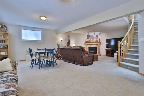 185 Hamptons Square Nw, Calgary, AB - Indoor With Fireplace