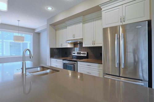 185 Panatella Square Nw, Calgary, AB - Indoor Photo Showing Kitchen With Stainless Steel Kitchen With Double Sink With Upgraded Kitchen