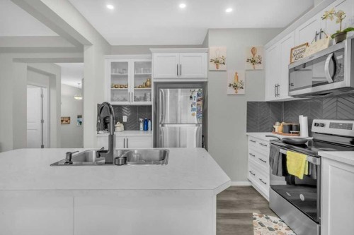 749 Windrow Manor Sw, Airdrie, AB - Indoor Photo Showing Kitchen With Double Sink With Upgraded Kitchen