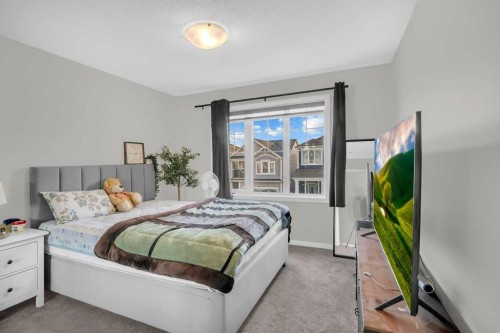 749 Windrow Manor Sw, Airdrie, AB - Indoor Photo Showing Bedroom