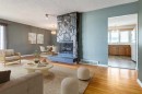 244 Maple Court Crescent Se, Calgary, AB  - Indoor Photo Showing Living Room With Fireplace 