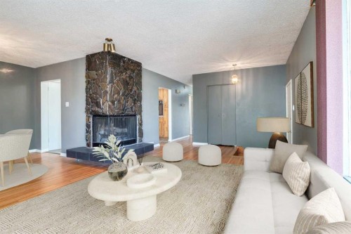 244 Maple Court Crescent Se, Calgary, AB - Indoor Photo Showing Living Room With Fireplace