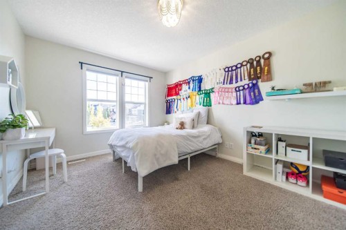 27 Sunset Park, Cochrane, AB - Indoor Photo Showing Bedroom