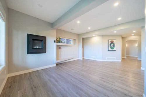 27 Sunset Park, Cochrane, AB - Indoor With Fireplace
