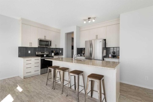 124 Carringham Way Nw, Calgary, AB - Indoor Photo Showing Kitchen With Stainless Steel Kitchen