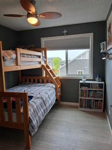 49 Fireside Bend, Cochrane, AB - Indoor Photo Showing Bedroom