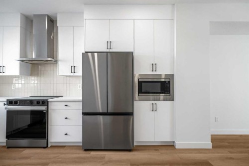 302-550 Seton Circle Se, Calgary, AB - Indoor Photo Showing Kitchen With Stainless Steel Kitchen With Upgraded Kitchen