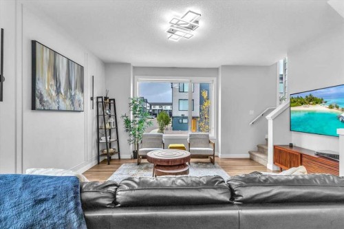 203 Evanscrest Square Nw, Calgary, AB - Indoor Photo Showing Living Room