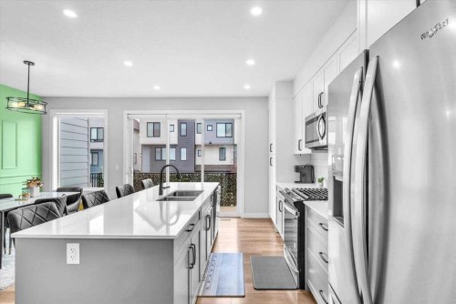 203 Evanscrest Square Nw, Calgary, AB - Indoor Photo Showing Kitchen With Double Sink With Upgraded Kitchen