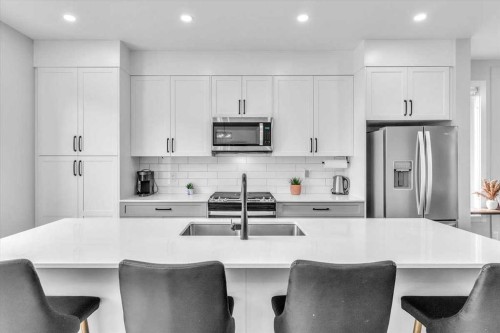 203 Evanscrest Square Nw, Calgary, AB - Indoor Photo Showing Kitchen With Stainless Steel Kitchen With Upgraded Kitchen