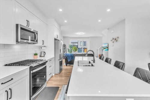 203 Evanscrest Square Nw, Calgary, AB - Indoor Photo Showing Kitchen With Stainless Steel Kitchen With Upgraded Kitchen