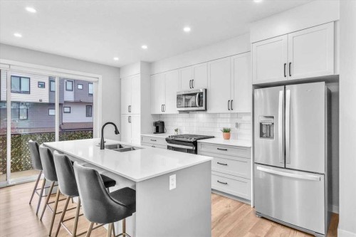 203 Evanscrest Square Nw, Calgary, AB - Indoor Photo Showing Kitchen With Stainless Steel Kitchen With Double Sink With Upgraded Kitchen