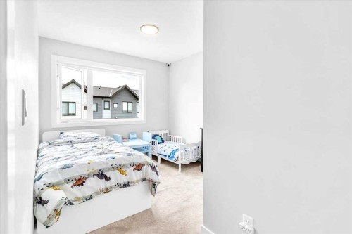 203 Evanscrest Square Nw, Calgary, AB - Indoor Photo Showing Bedroom