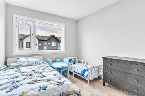 203 Evanscrest Square Nw, Calgary, AB - Indoor Photo Showing Bedroom