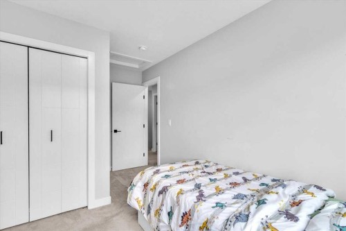 203 Evanscrest Square Nw, Calgary, AB - Indoor Photo Showing Bedroom