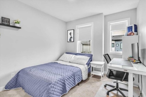 203 Evanscrest Square Nw, Calgary, AB - Indoor Photo Showing Bedroom