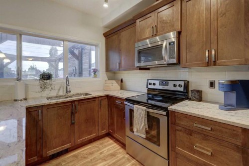 468 Hillcrest Circle Sw, Airdrie, AB - Indoor Photo Showing Kitchen With Stainless Steel Kitchen With Double Sink