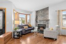 177 Hidden Vale Close Nw, Calgary, AB  - Indoor Photo Showing Living Room With Fireplace 